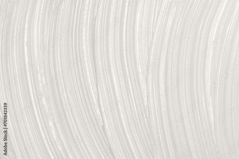 Thick white cosmetic cream applied to the surface. texture of the cream close-up. Thick white cosmetic cream applied to the surface. texture of the cream close-up.