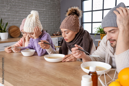 Ill family eating soup at t...