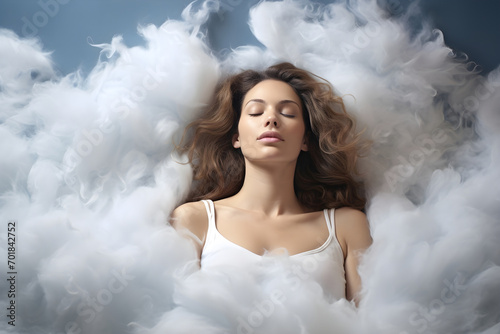 Beautiful woman lying sleeping surrounded by fluffy cottony clouds in the sky on a dreamy scene. Tranquility and relaxation dreaming concept