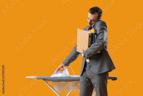 Young businessman with fold...