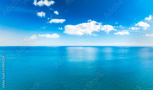 panoramic drone view of sea and sky with clouds