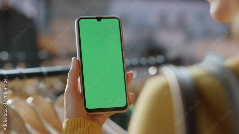 Customer lady scrolling chromakey smartphone mall closeup. Shopaholic browsing