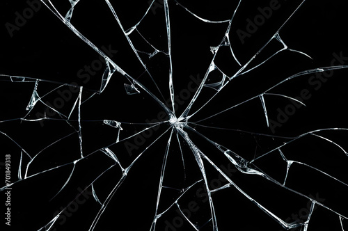Photo of broken glass on a black background, cracks. photo