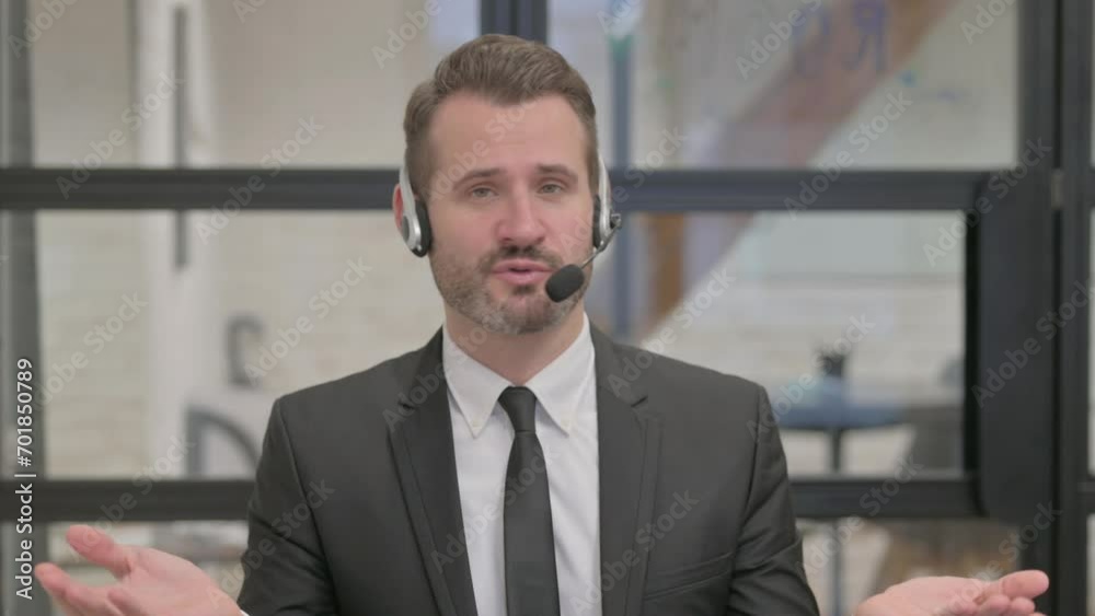 Call Center Employee with Headset Talking while Doing Video Chat Call Center Employee with Headset Talking while Doing Video Chat