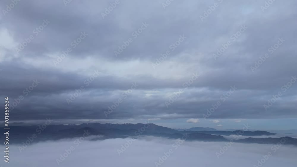 time lapse of fog rising and moving in the sky near the Alps mountains time lapse of fog rising and moving in the sky near the Alps mountains