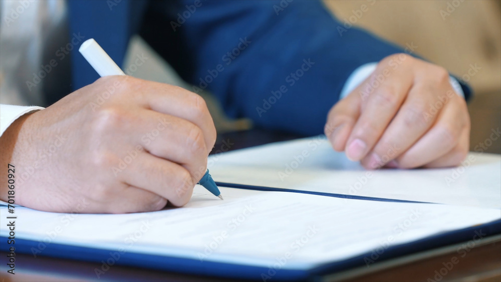 Business man signing a contract. Business man signing a contract.