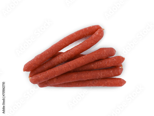 Thin dry smoked sausages isolated on white, top view