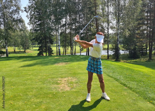 Wallpaper Mural Professional female golfer in sportswear plays golf at golf practice tournament on course Torontodigital.ca