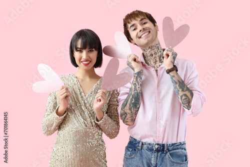 Young couple with paper hea...