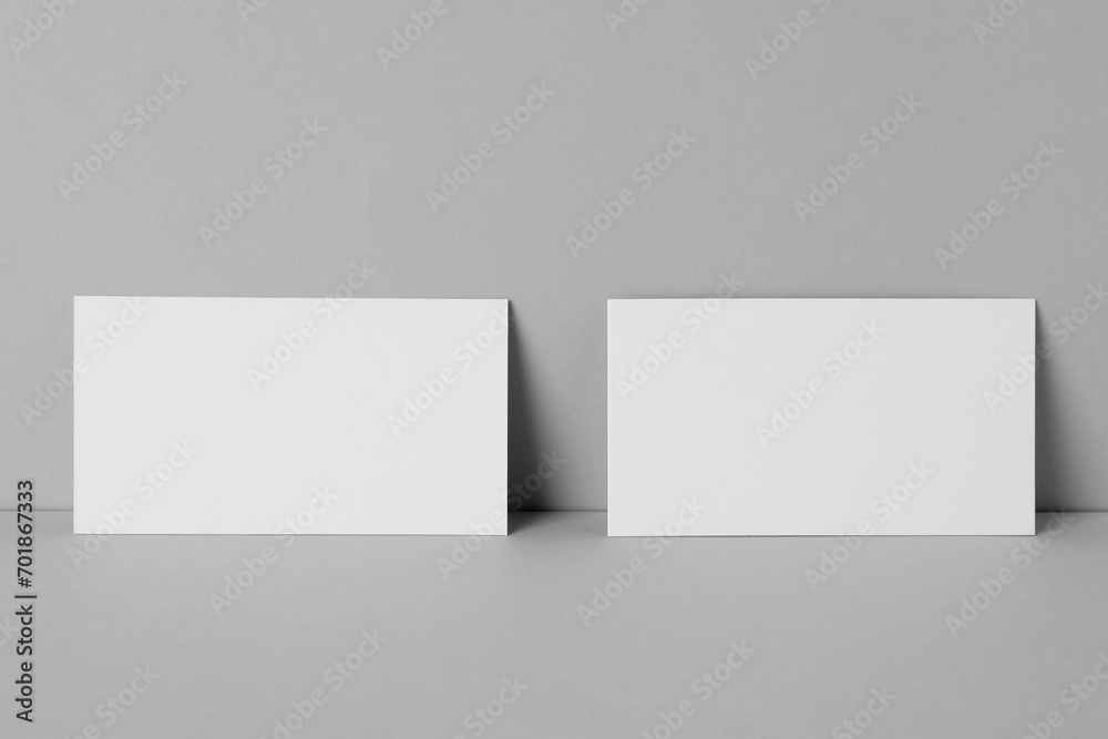 Blank business cards on light gray background. Mockup for design Blank business cards on light gray background. Mockup for design