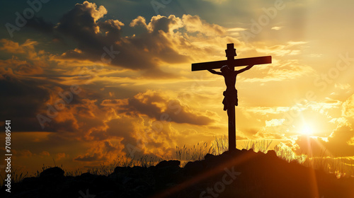 jesus christ on a cross in a field at sunshine sunrise