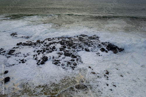 Aerial view of waves crashing on the rocky south coast of Mauritius island
