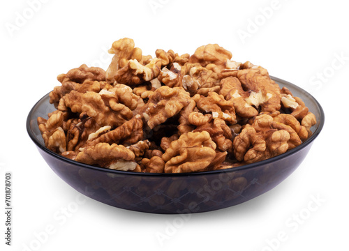 Walnut kernels on plate  on a white background