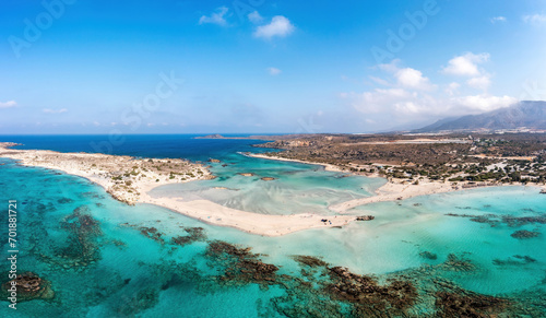 Fototapeta Naklejka Na Ścianę i Meble -  Elafonisi Crete island Greece. Aerial drone view of turquoise water, underwater rocky formation.