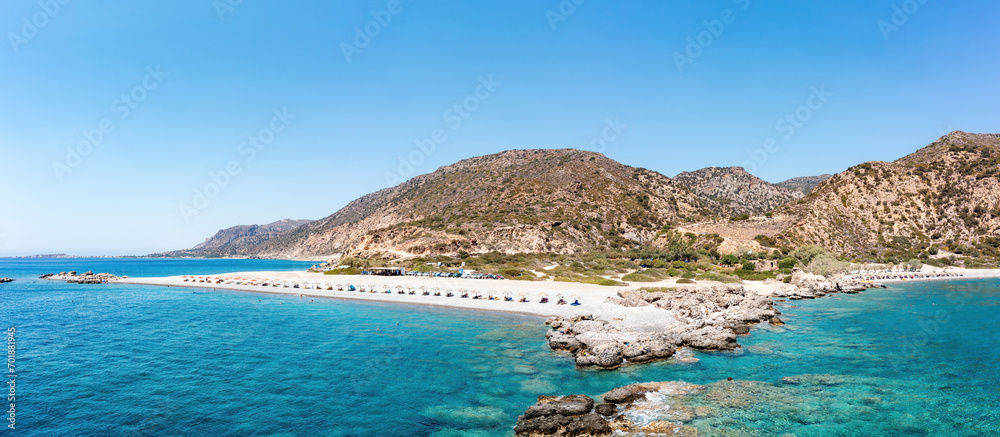 Crete Greece. Aerial drone view of pebble beach at Palaiochora, transparent crystal clear sea water. - obrazy, fototapety, plakaty 