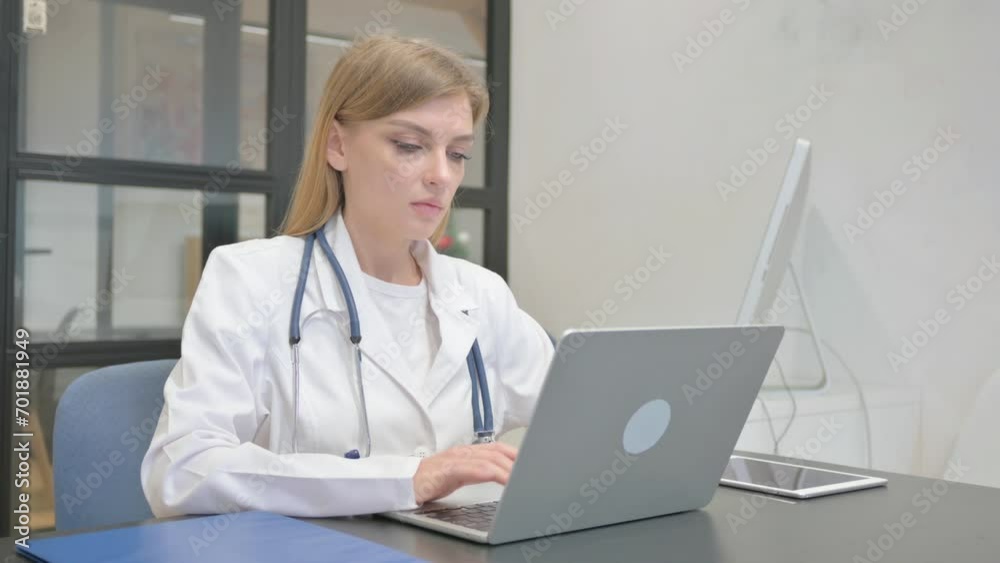 Female Doctor Typing on Laptop in Clinic Female Doctor Typing on Laptop in Clinic