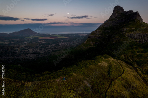 Aerial view of Trois mamelles mountain and the west coast of Mauritius island during a full moon at dawn photo