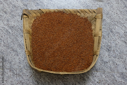 Ragi or finger millet in a dust pan