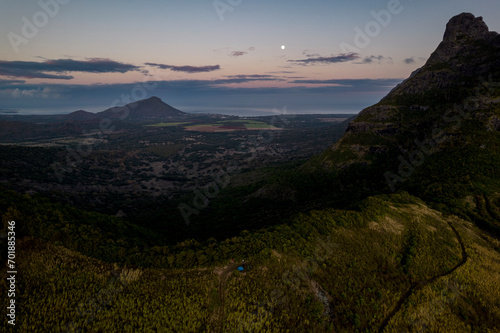 Aerial view of Trois mamelles mountain and the west coast of Mauritius island during a full moon at dawn photo