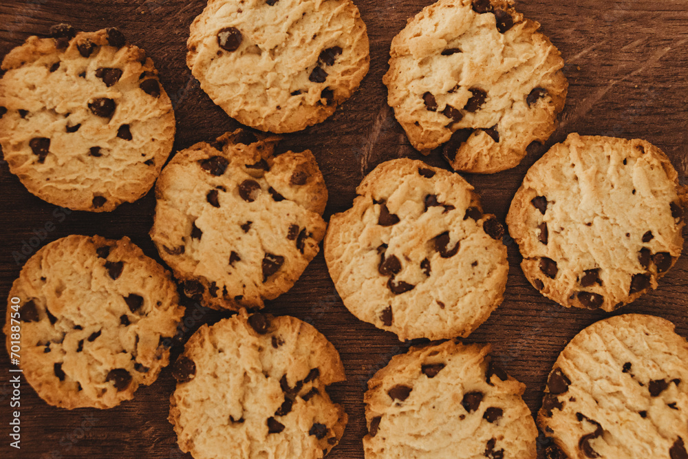 Savoring Simplicity: Homemade Cookies with a Glass of Milk on an Elegant Wooden Table. Savoring Simplicity: Homemade Cookies with a Glass of Milk on an Elegant Wooden Table.