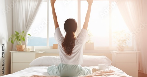 A Charming Asian Woman Stretching with Hands Up, Waking Up on a Bed in a White Room with Air Conditioning. Generative AI