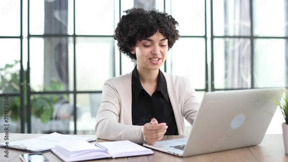 Portrait of Young Successful Caucasian Businesswoman Sitting at Desk Working on Laptop