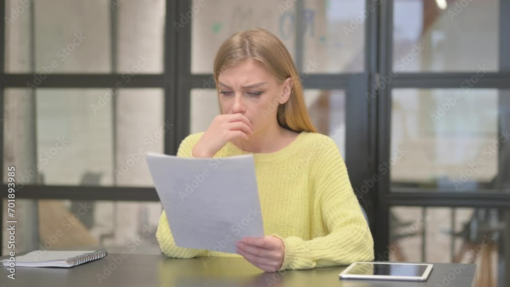 Casual Creative Woman Feeling Upset while Reading Contract Casual Creative Woman Feeling Upset while Reading Contract