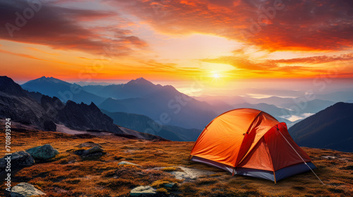 Camping in the mountains at sunset. The concept of active tourism