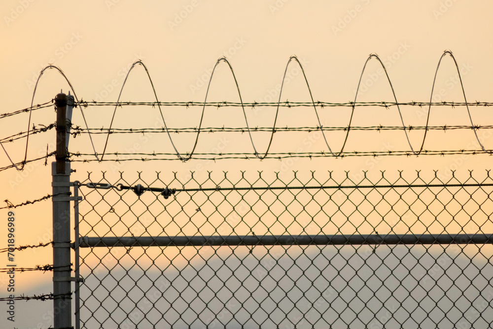 4K Ultra HD Image of Barbed Wire at the Airport Perimeter 4K Ultra HD Image of Barbed Wire at the Airport Perimeter