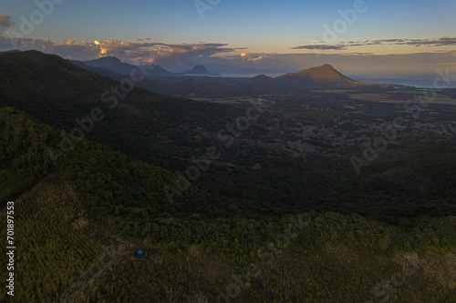 Aerial HDR view of Trois mamelles mountain and the west coast of Mauritius island during a full moon at dawn photo