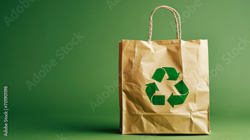 A paper bag with a recycling symbol on a refreshing green backdrop  providing space for copying. This eco-recycling concept highlights the dedication to preserving nature