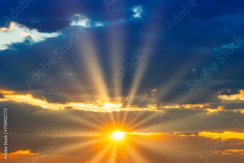 Sunset sky with sunset clouds, sun rays and dramatic sky