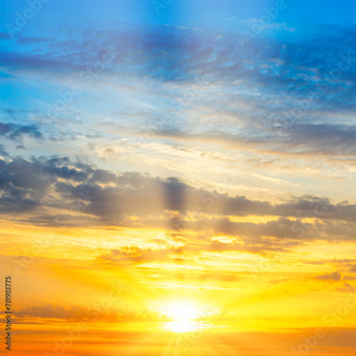 Sunset sky with sunset clouds, sun rays and dramatic sky