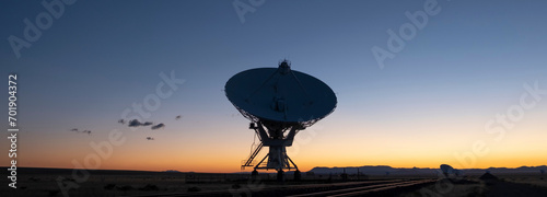 4K Ultra HD Image of Single Satellite Dish Antenna Against Sunset Sky photo