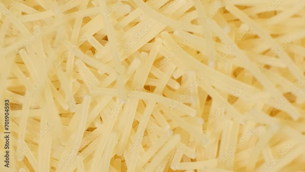 Close up of raw macaroni. Cooking pasta. Macaroni background. Vertical video Close up of raw macaroni. Cooking pasta. Macaroni background. Vertical video
