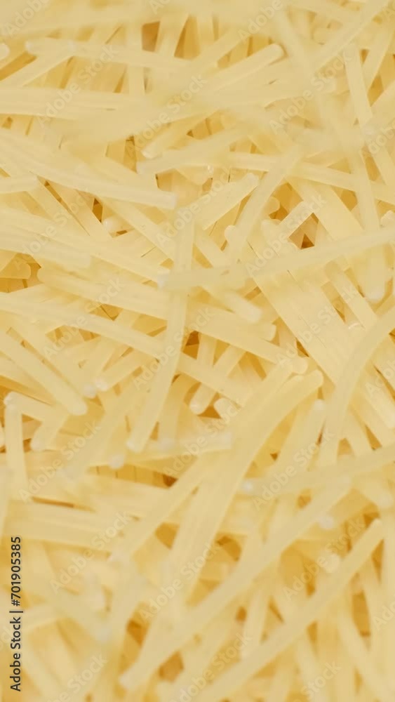 Close up of raw macaroni. Cooking pasta. Macaroni background. Vertical video Close up of raw macaroni. Cooking pasta. Macaroni background. Vertical video