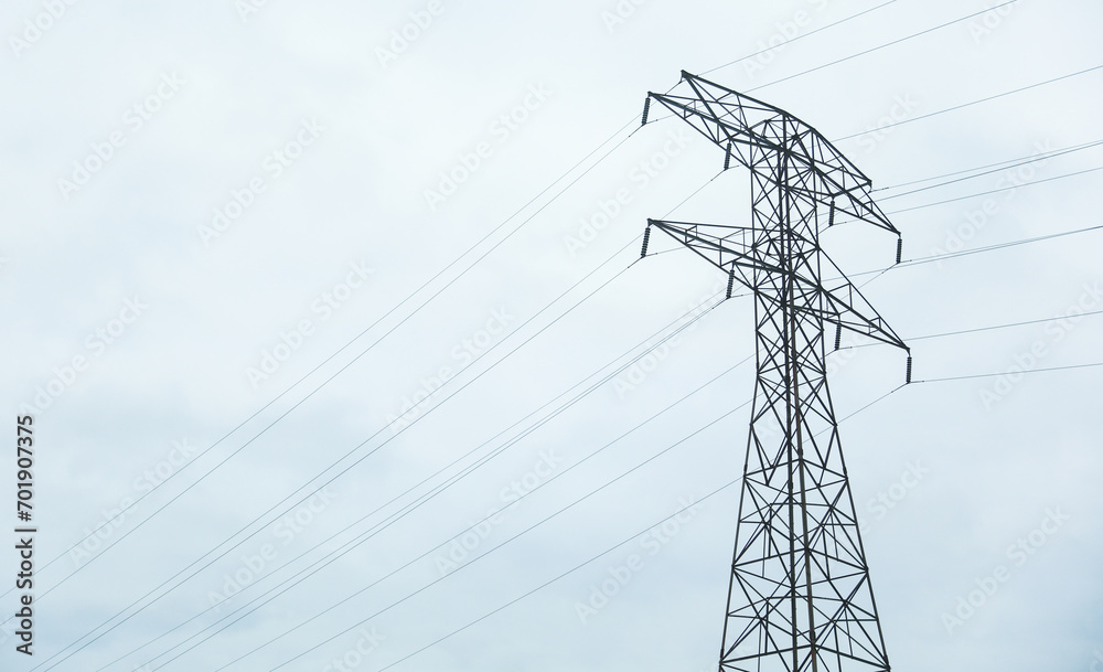 Electric power lines silhouette against vibrant sky, symbolizing energy, connection, and modern infrastructure Electric power lines silhouette against vibrant sky, symbolizing energy, connection, and modern infrastructure