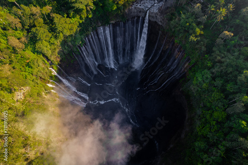 Aerial view of Tumpak Sewu waterfall during a morning in East Java, Indonesia