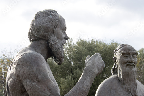 Statue of Socrates and Confucius inside the Ancient Ruins in Athens Greece
