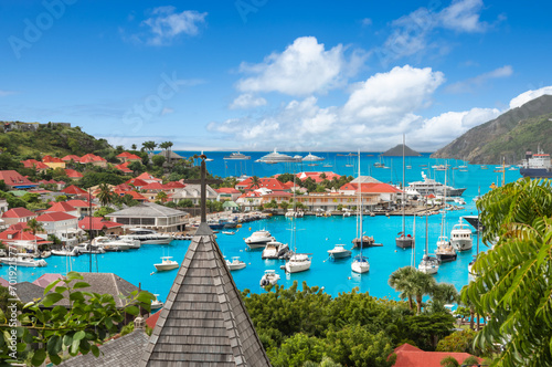 Obraz na płótnie Gustavia, Saint Barthelemy harbor and skyline. Church roof in the front. w salonie
