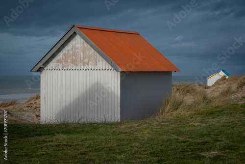 Gouville, France - 12 30 2023: View of colorful bathing wooden cabins of Gouville on the dunes.