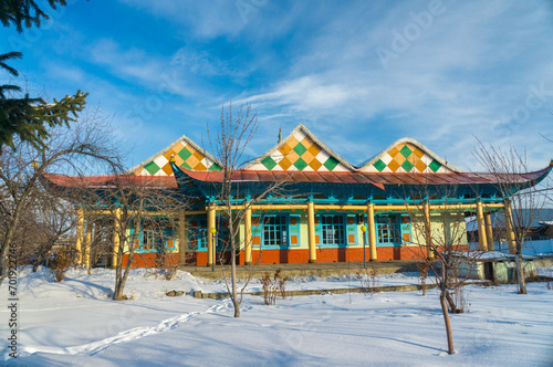 Wooden Dungan mosque of Ibrahim Haji in Karakol city, built by Chinese Muslims. Patterned green roof, Islamic, minaret photo