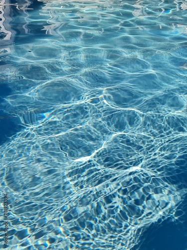 refection of swimming pool on the sunny day, water in swimming pool  © Tipparat