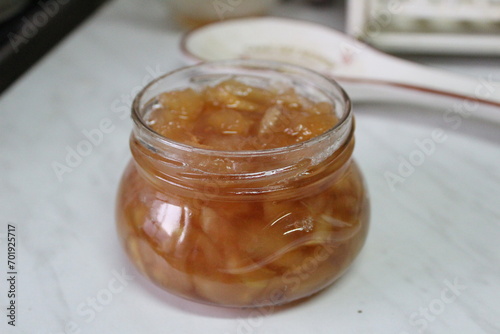 a jar of delicious apple jam on the kitchen table