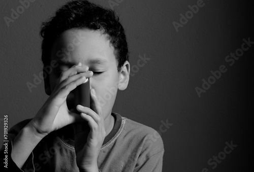 child with flu and inhaler respiratory puff on grey background with people stock photo  photo