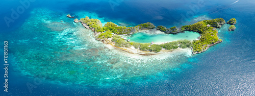 Rufas Island is fringed by beautiful coral reefs in Raja Ampat, Indonesia. This region is known for its exquisite coral reefs and overall high marine biodiversity.