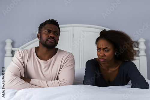 Couple in bed with sexual and marital issues, arguing.