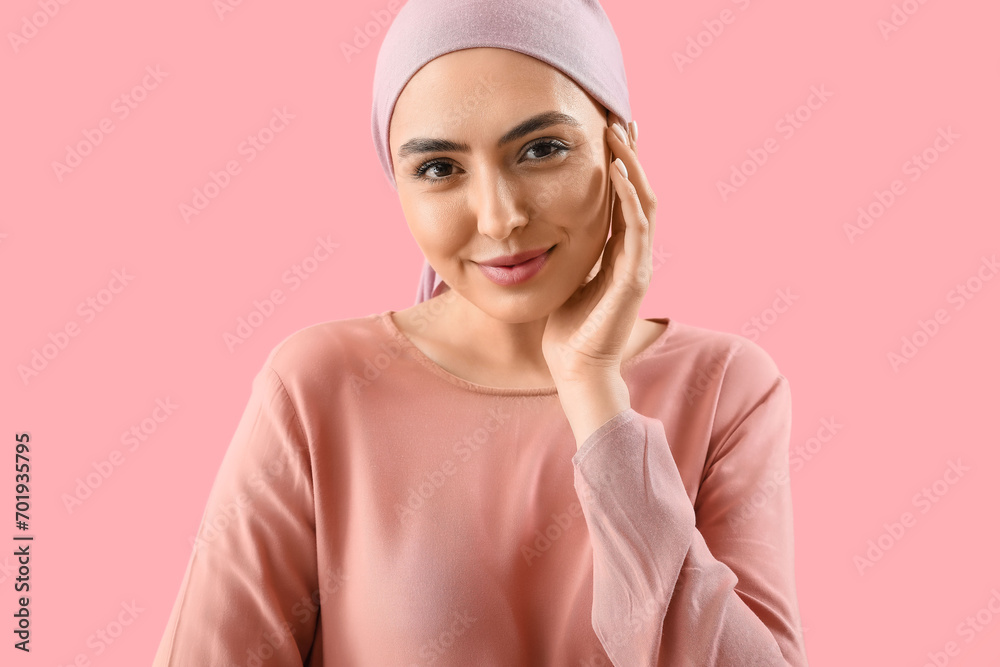 Young woman after chemotherapy on pink background, closeup Young woman after chemotherapy on pink background, closeup