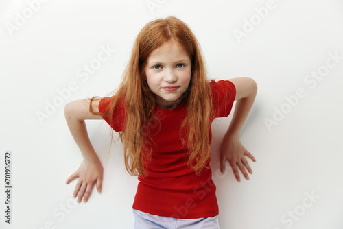 Indoor redhead face portrait little female children girl red expression isolated caucasian background unhappy kid photo