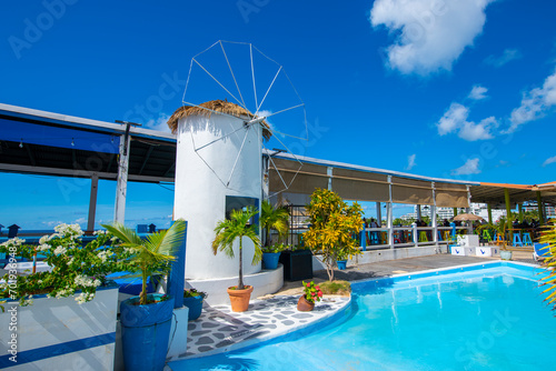 Sunset Bar and Grill with Dutch style windmill at Maho Beach on Sint Maarten, Dutch Caribbean.  photo